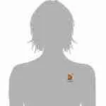 Patchwork quilt pin with dangling chain shown on gray bust form at chest level