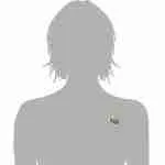 Multicolor dog pin with spiral tail shown on gray bust form at chest level