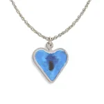 Back of heart pendant showing stainless steel frame and reverse painted surface in blue