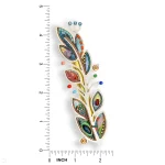 Feather-shaped mezuzah with multicolor painted barbs in turquoise, pink, and gold next to ruler showing 4.5 in height